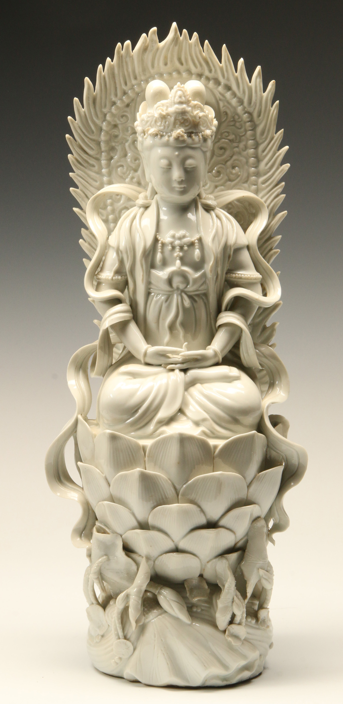 A CHINESE BLANC DE CHINE GUANYIN ON LOTUS THRONE