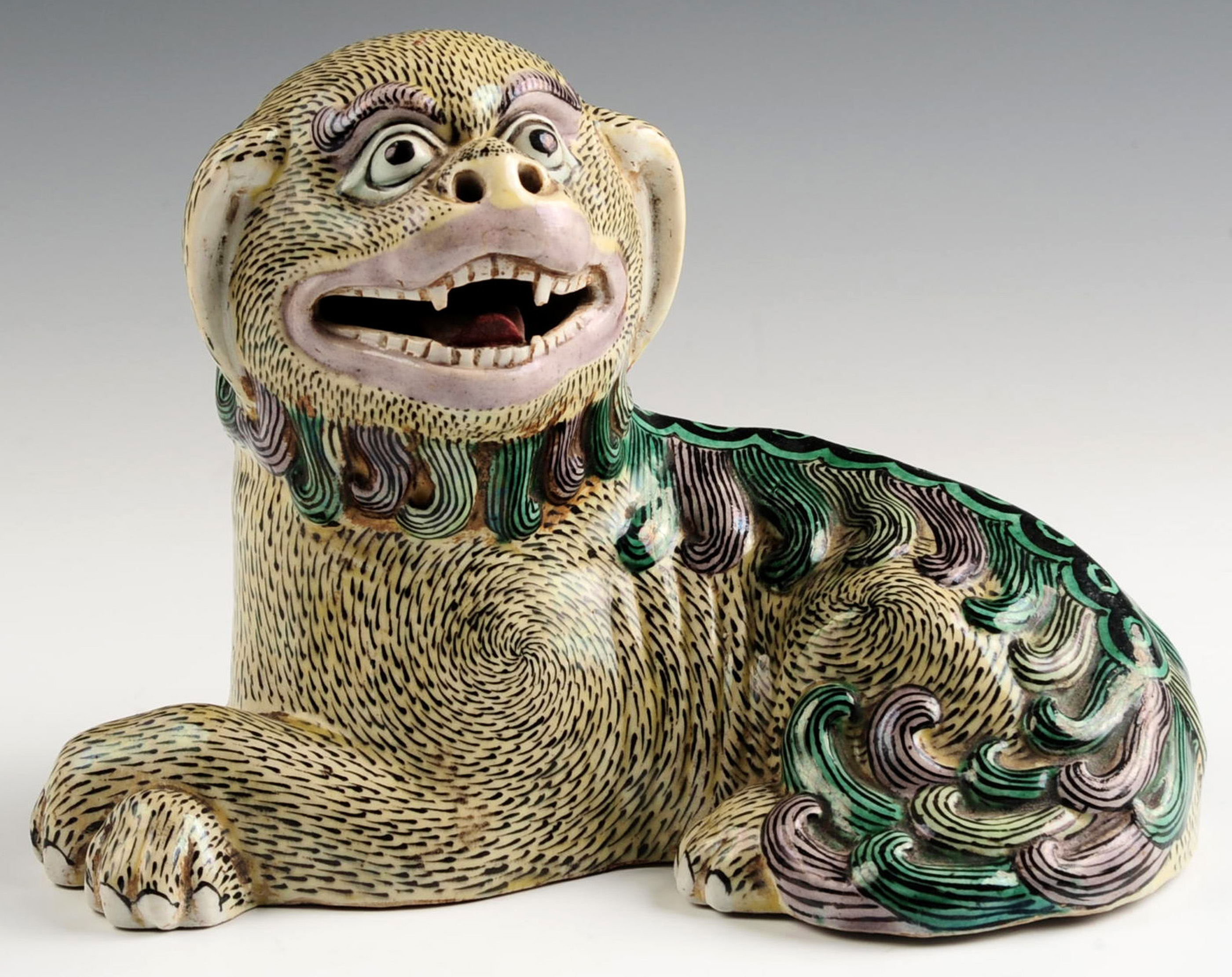 A 19TH CENTURY CHINESE BISCUIT GLAZE FU DOG FIGURE