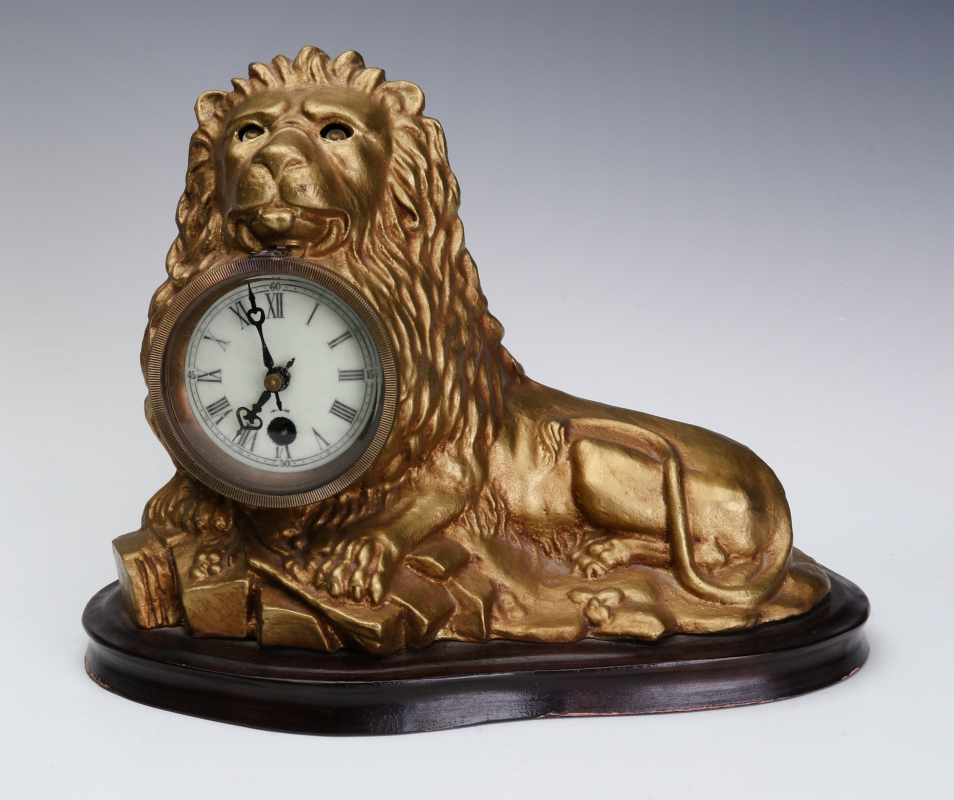 A REPRODUCTION ANIMATED LION CLOCK AFTER B & H