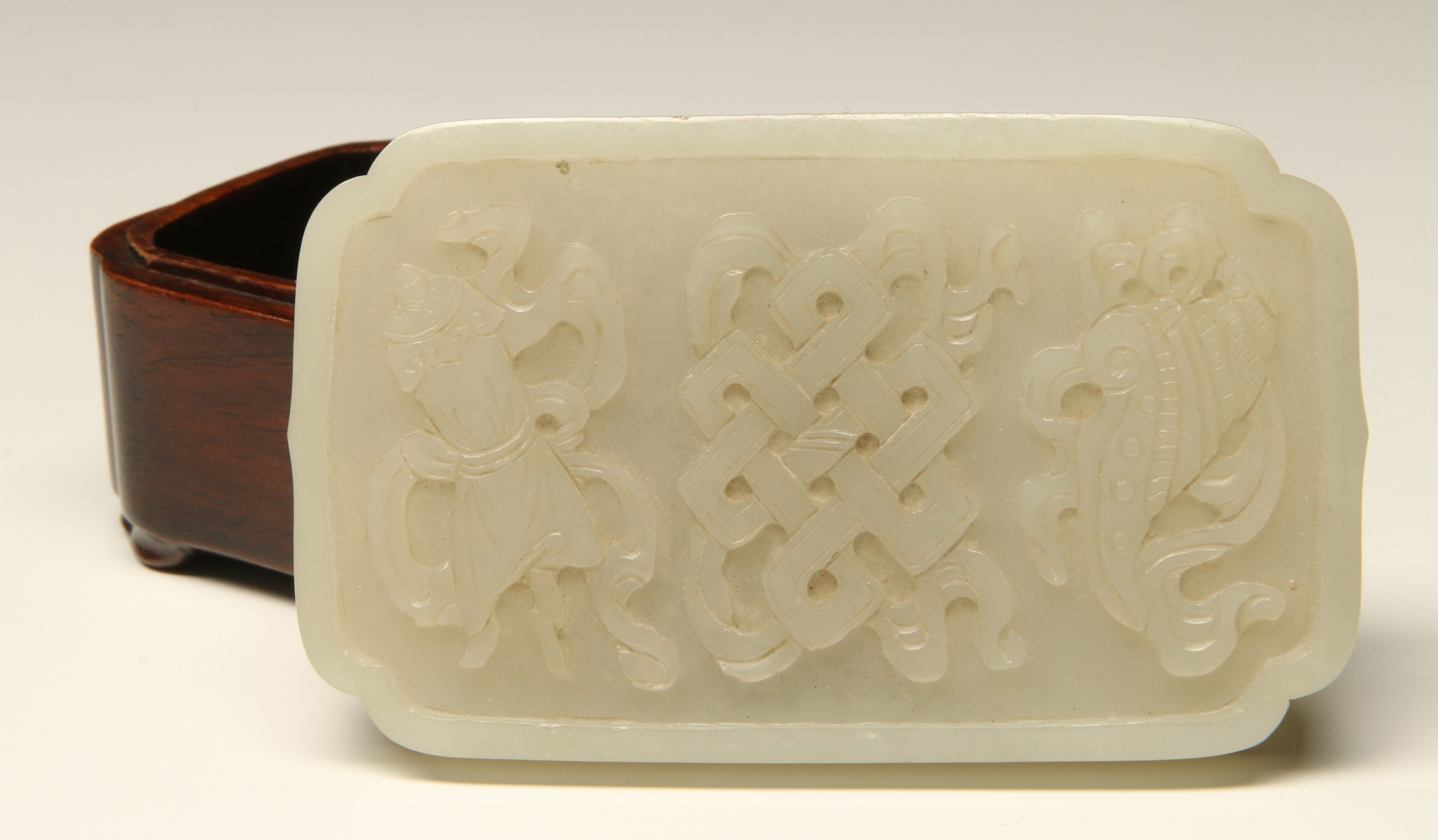 A CHINESE CARVED WHITE JADE BOX COVER