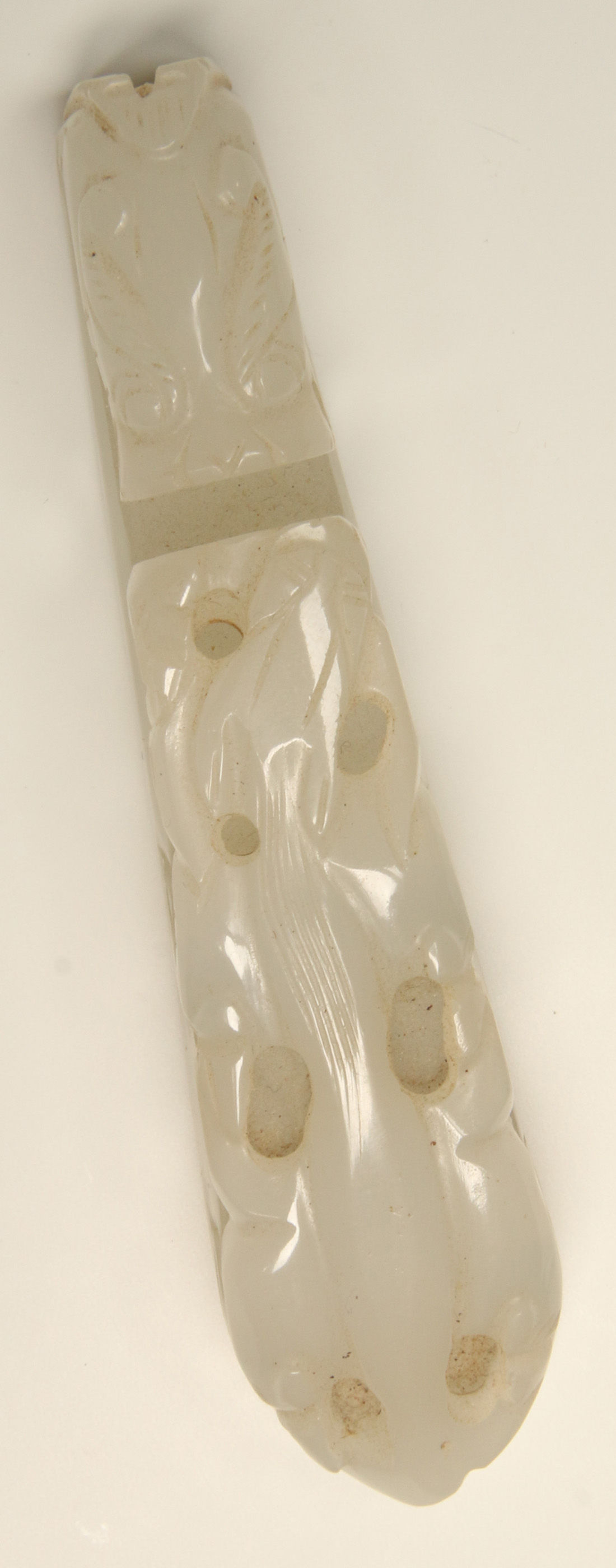 A CHINESE CARVED WHITE JADE BUCKLE
