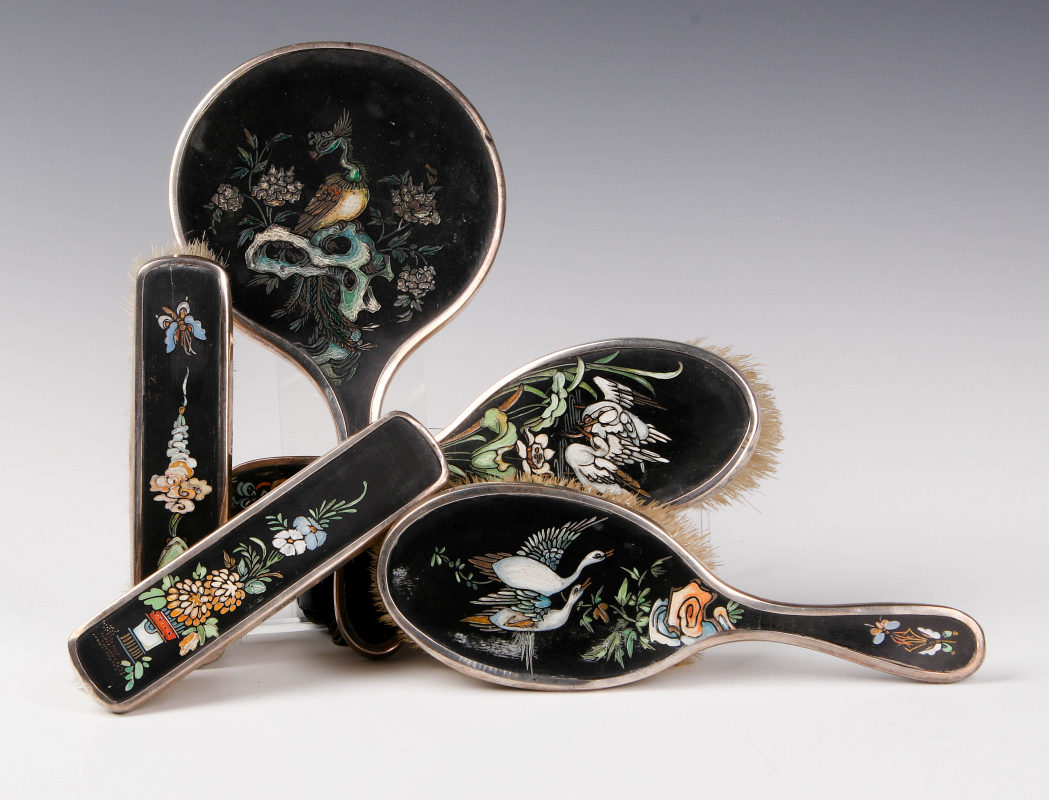 AN UNUSUAL STERLING AND CARVED LACQUER DRESSER SET