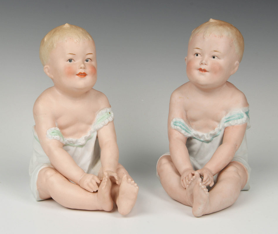 A PAIR 19TH C. VICTORIAN BISQUE PIANO BABY BOYS