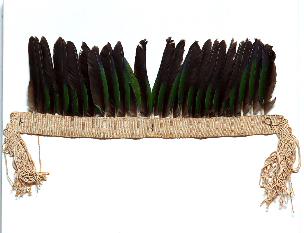A SOUTH AMERICAN FEATHERED HEADDRESSES