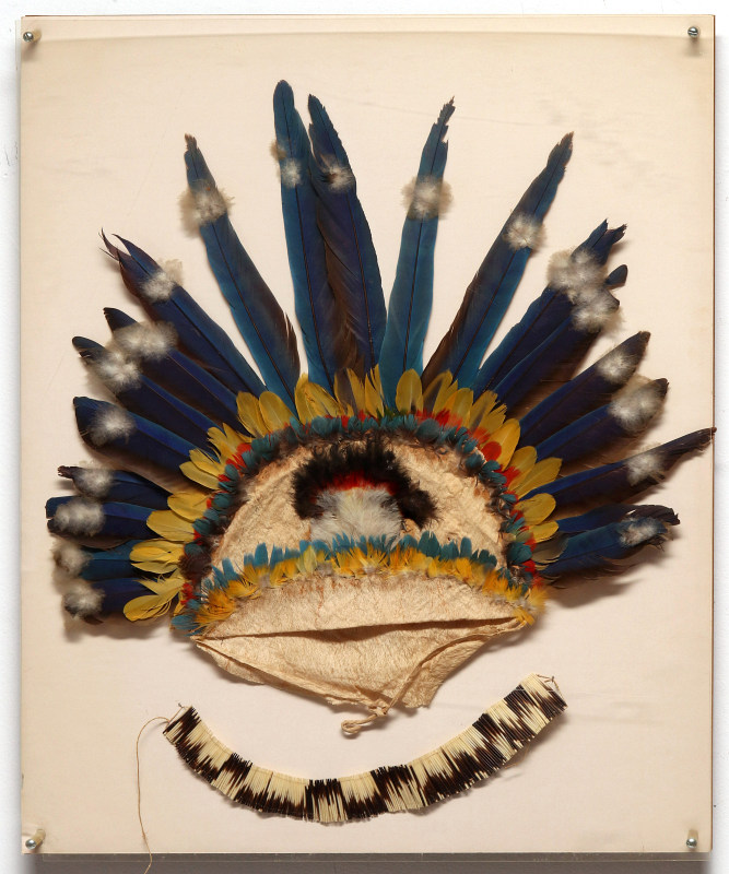 A SOUTH AMERICAN FEATHERED HEADDRESSES AND QUILL