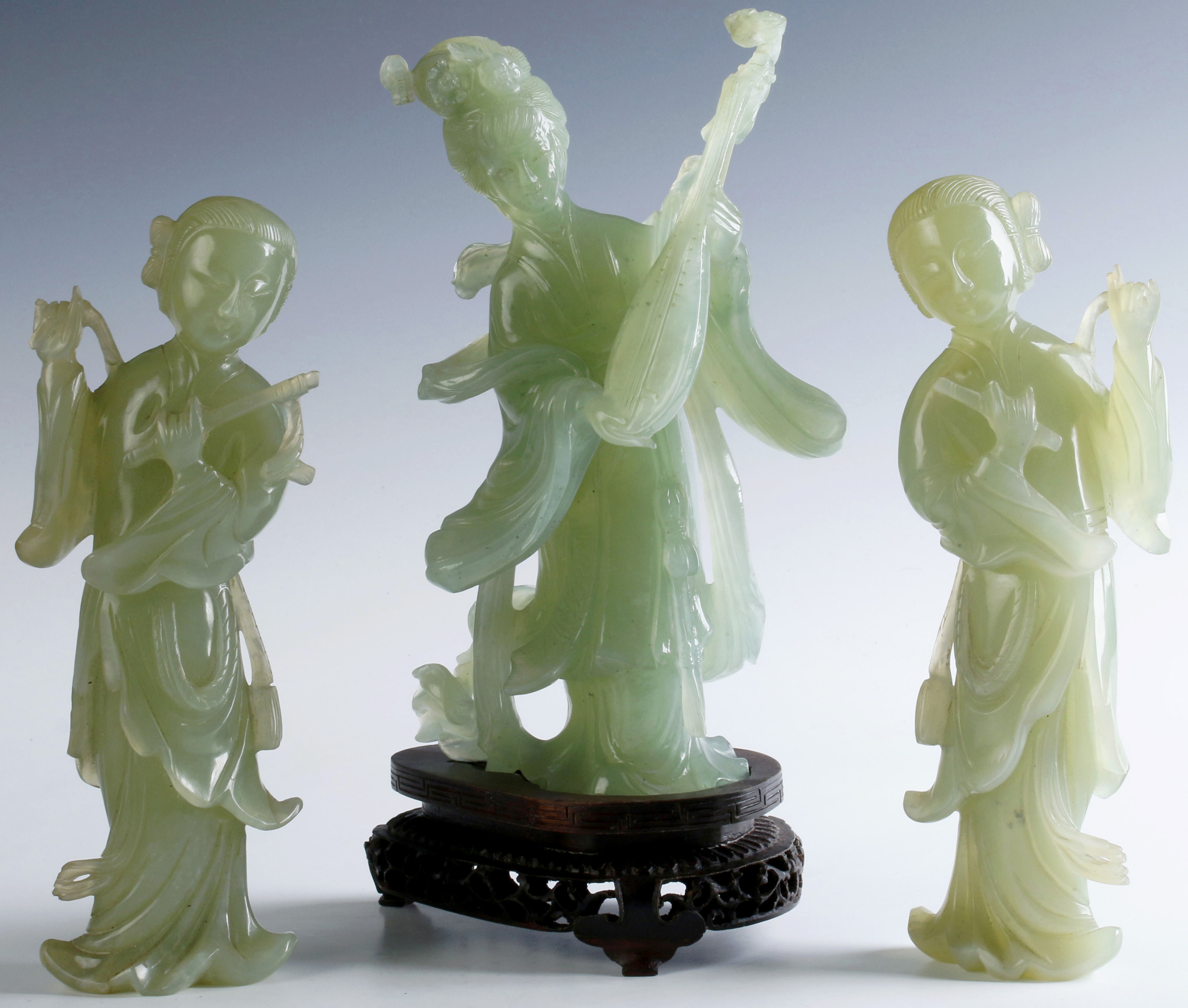 THREE CHINESE CARVED GREEN HARDSTONE FIGURINES