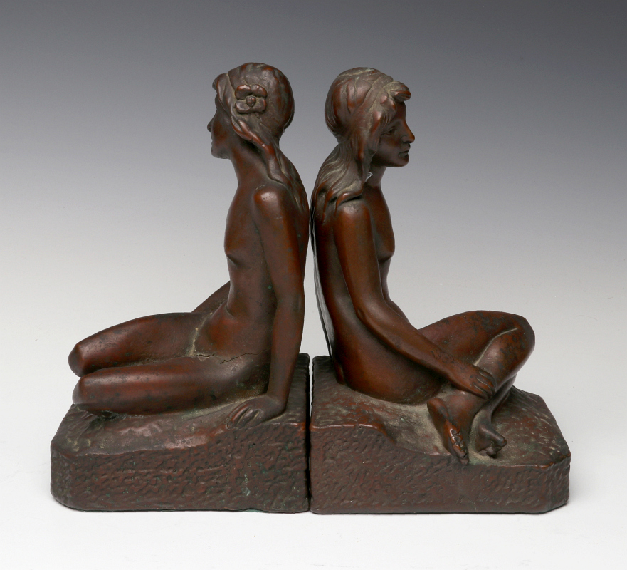 A PAIR FIGURAL NUDE BOOKENDS SIGNED 'ART BRONZE'
