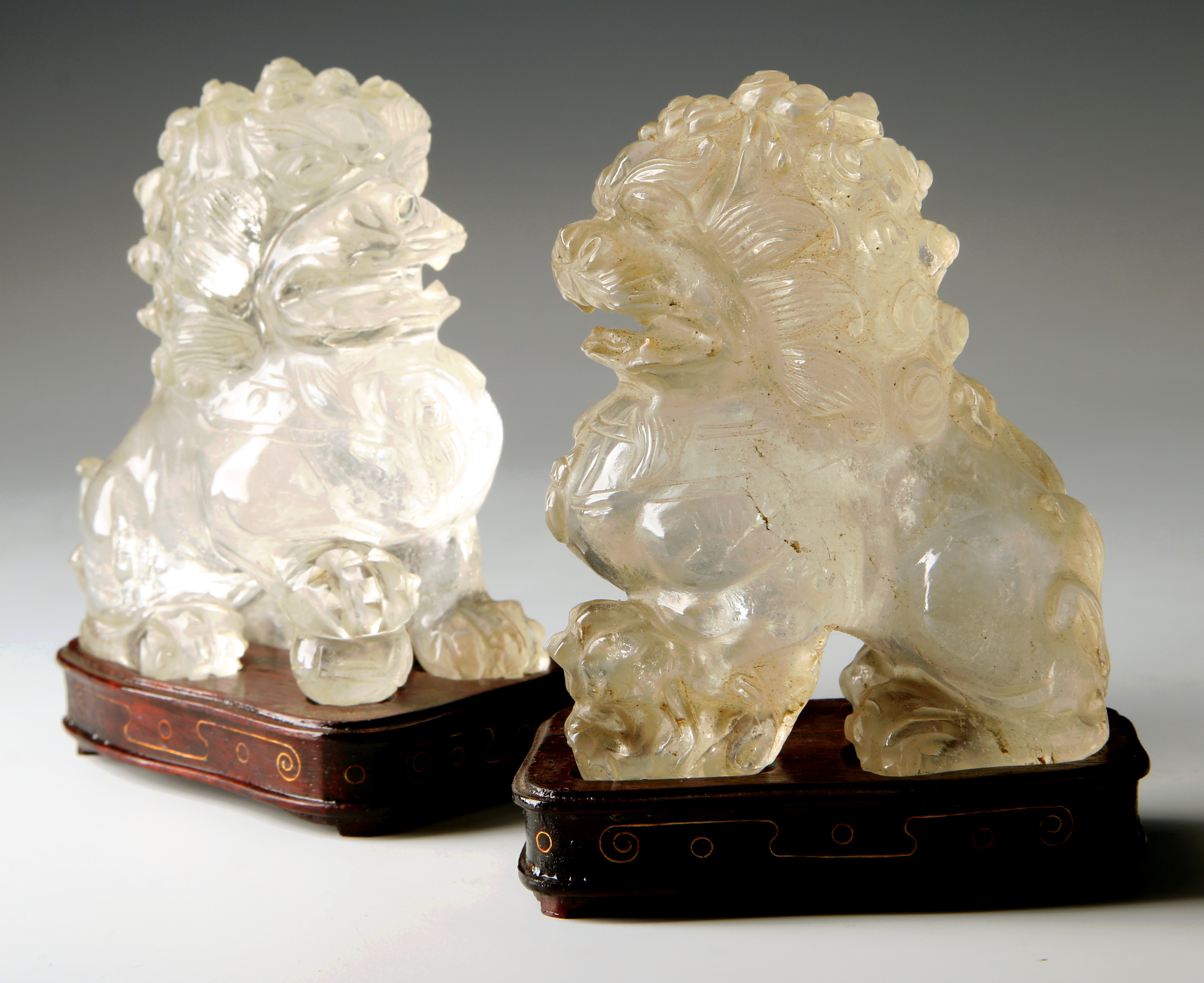 A PAIR OF CHINESE CARVED ROCK CRYSTAL FU DOGS