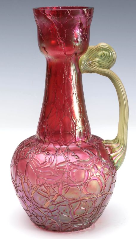 AN AUSTRIAN ART GLASS CRANBERRY CRACKLE EWER