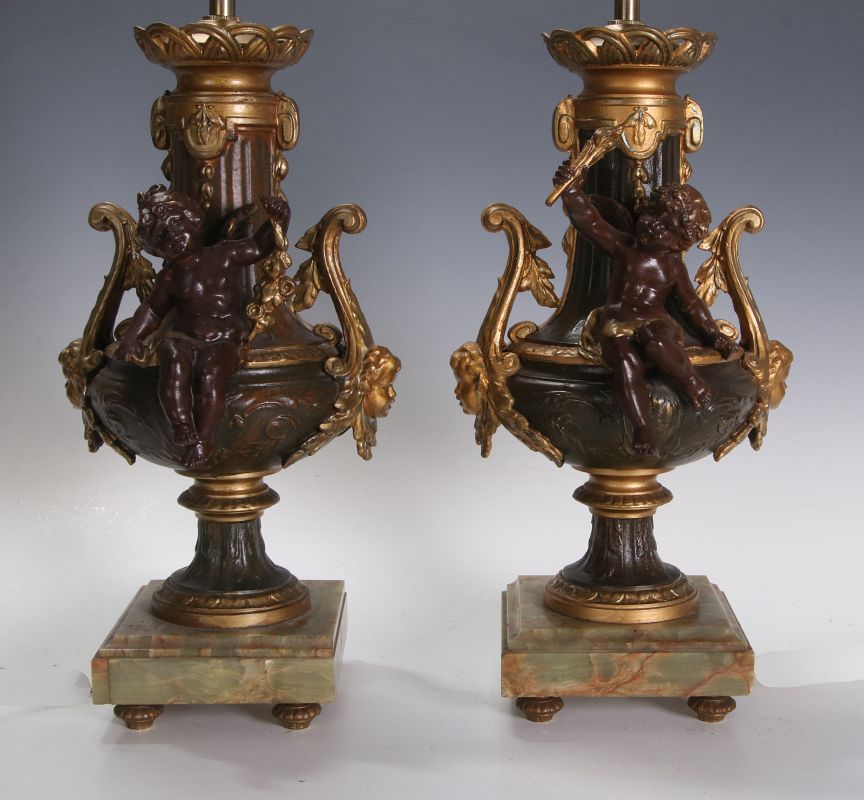 A PAIR GILT & PATINATED SPELTER URN & CHERUB LAMPS