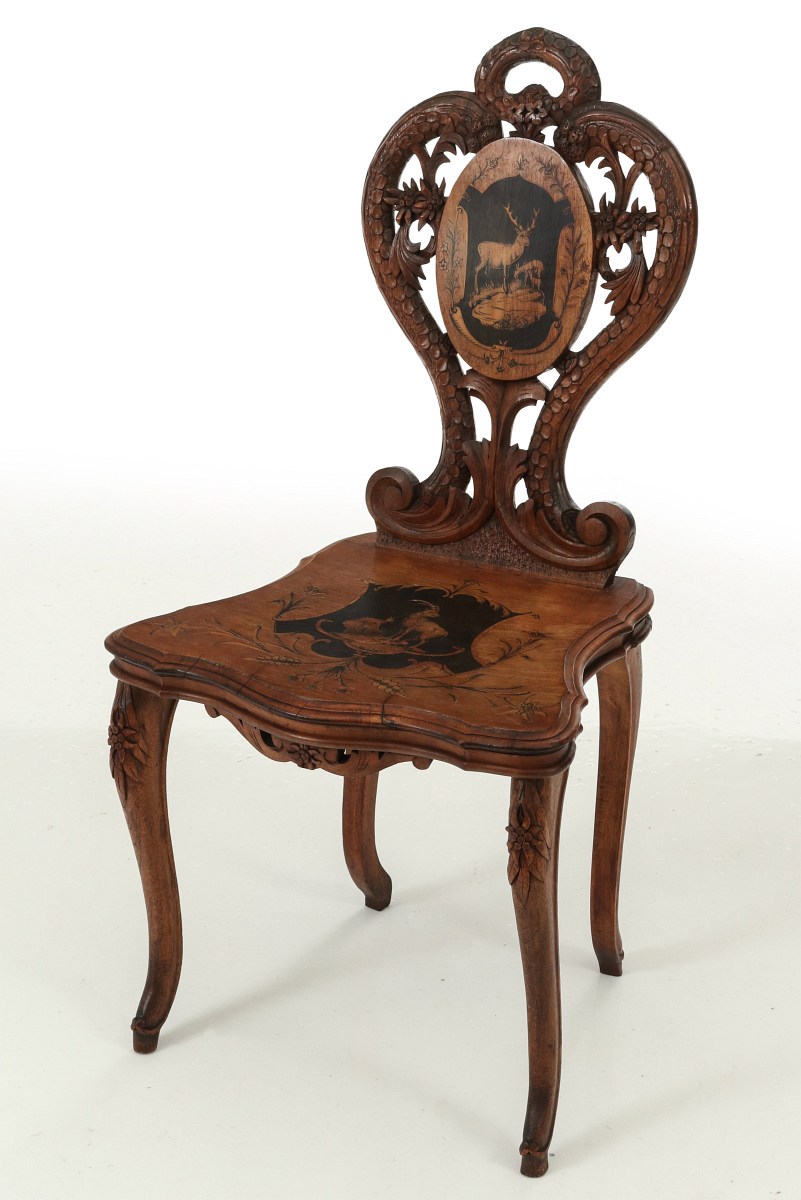 A 19TH C HAND CARVED AND INLAID BLACK FOREST CHAIR