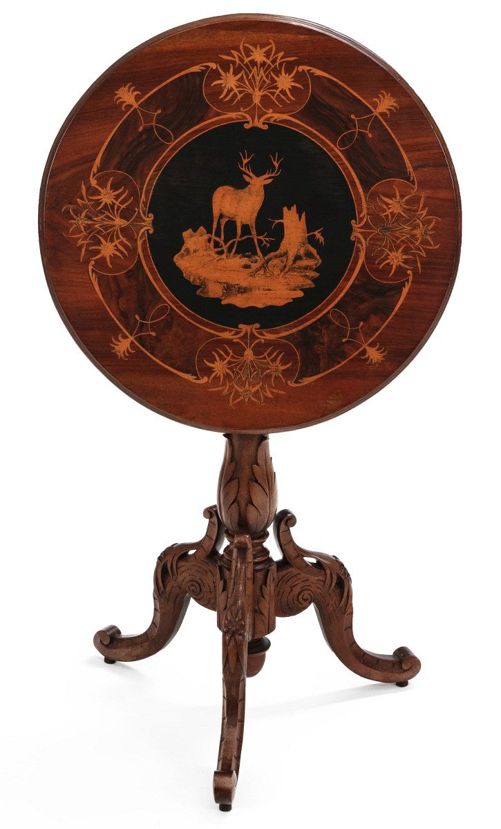A FINELY CARVED, INLAID BLACK FOREST TABLE C 1870s
