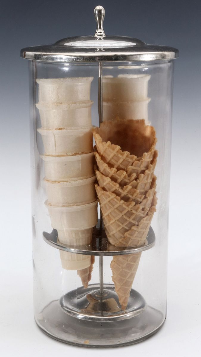 A SODA FOUNTAIN ICE CREAM CONE DISPENSING JAR