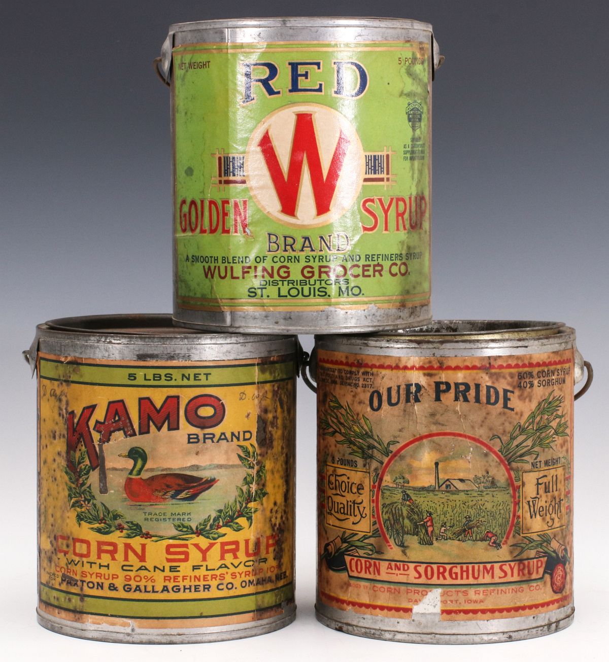 THREE TIN SYRUP PAILS WITH COLORFUL PAPER LABELS