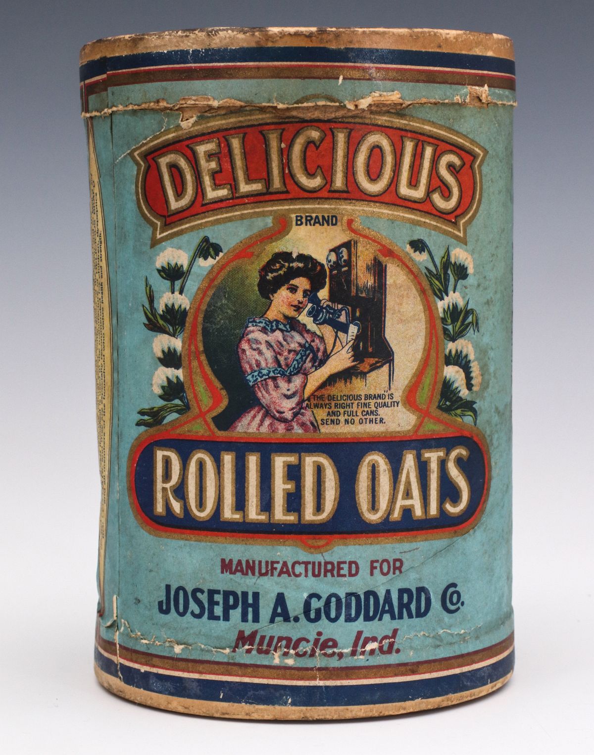A DELICIOUS BRAND ROLLED OATS CONTAINER CIRCA 1910