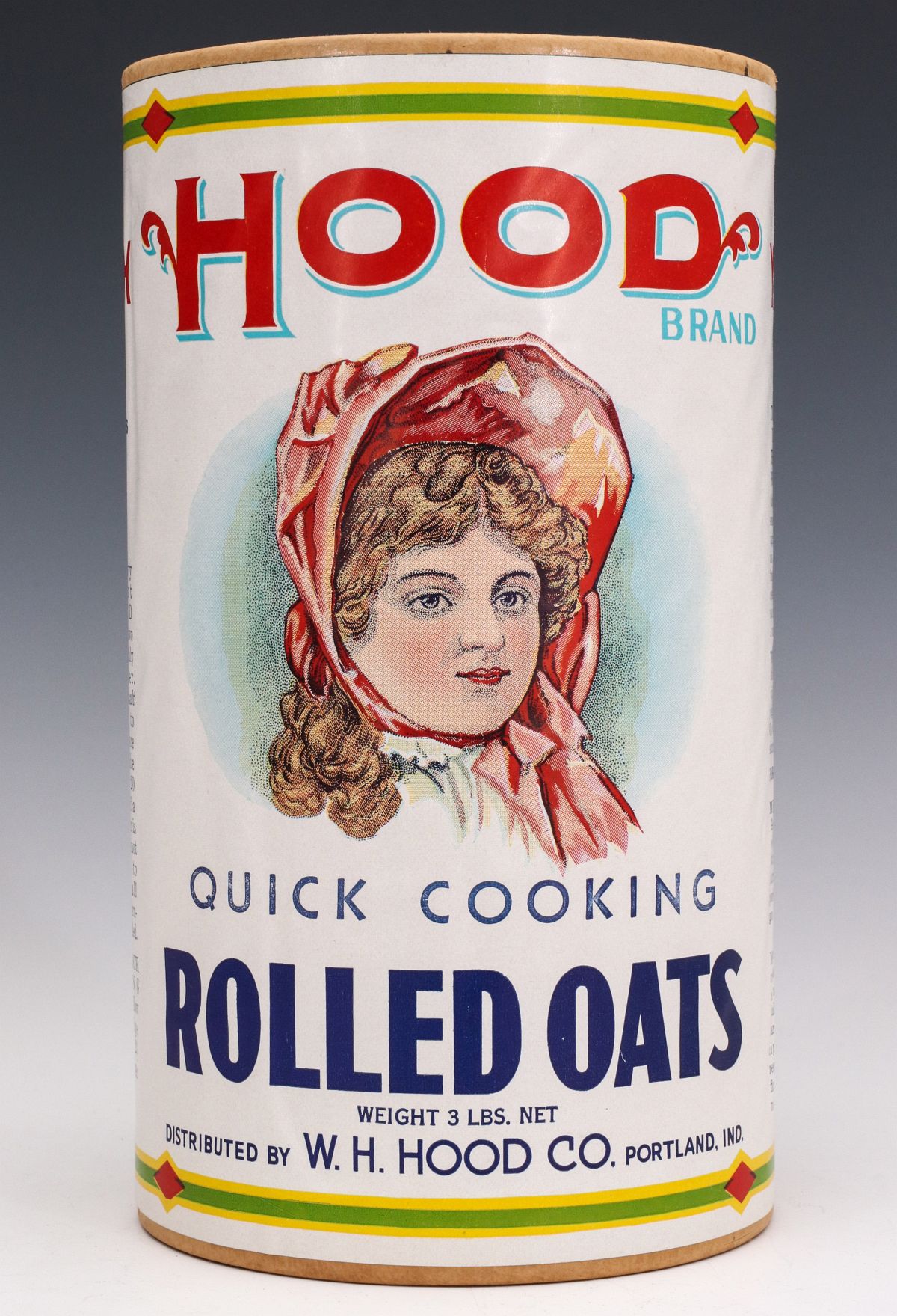 CARDBOARD OATS CONTAINER WITH COLORFUL HOOD LABEL
