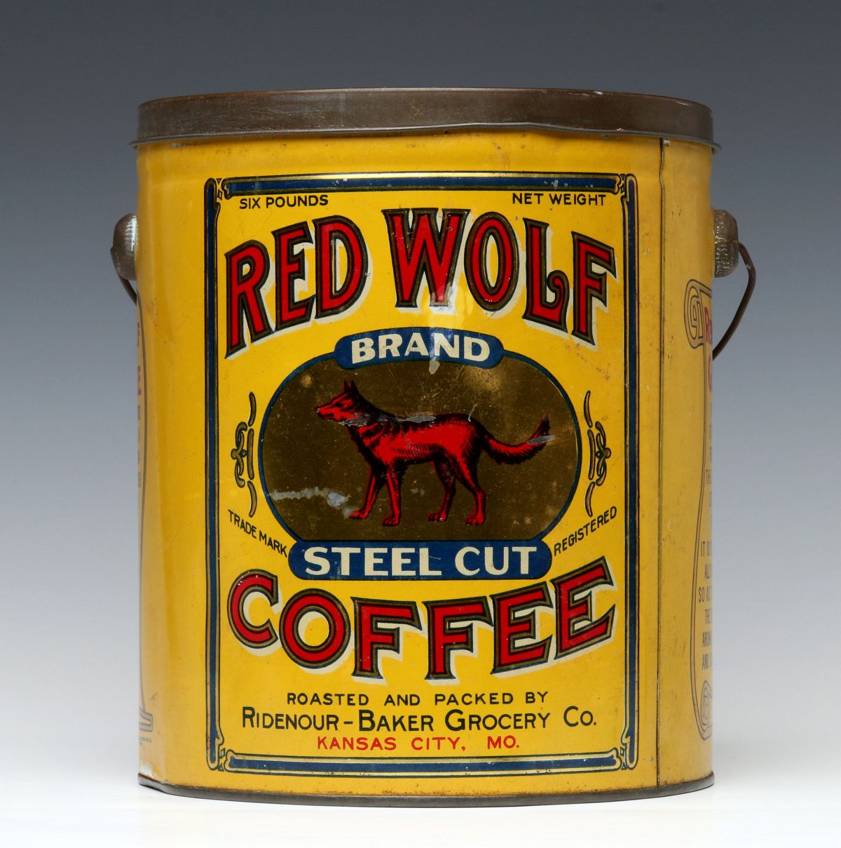 A RED WOLF BRAND SIX POUND TIN LITHO COFFEE PAIL