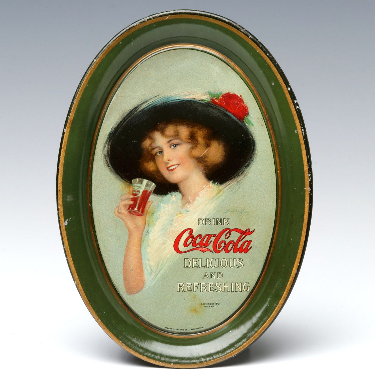 A COCA-COLA TIP TRAY DATED 1912