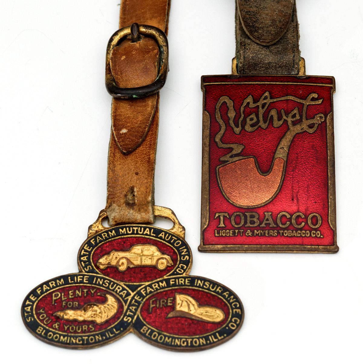TWO EARLY 1900s ENAMELED ADVERTISING WATCH FOBS