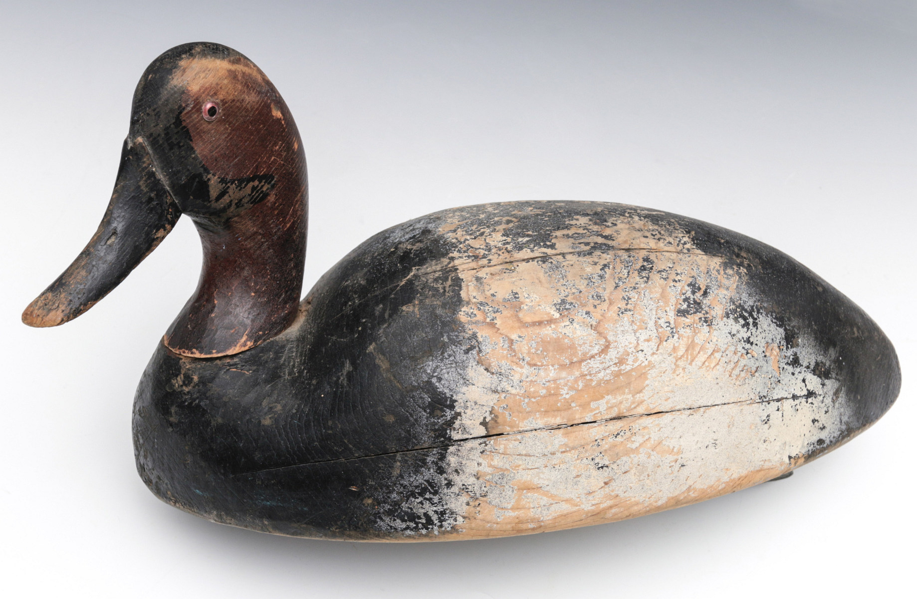 AN EARLY 20TH C CANVASBACK DRAKE WOODEN DECOY