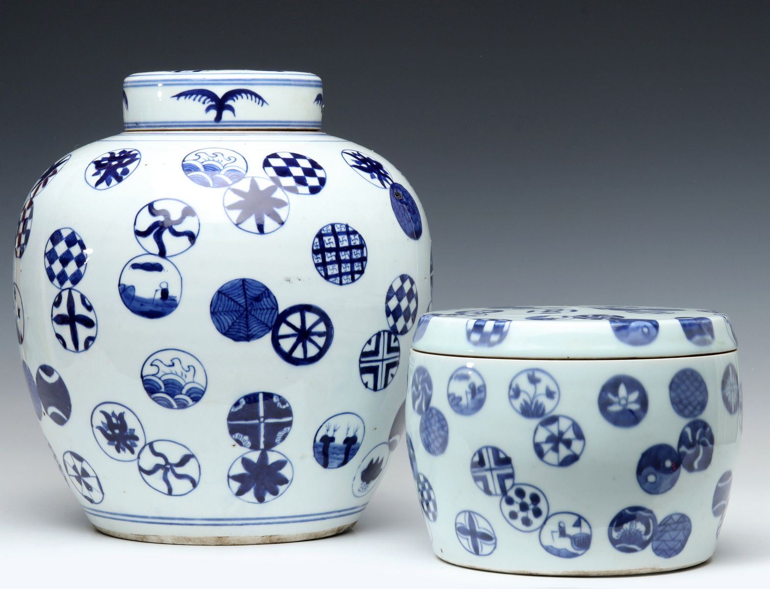TWO CHINESE BLUE AND WHITE COVERED VASES
