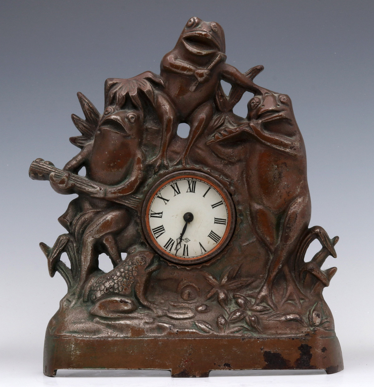 AN UNUSUAL 'FROG BAND' CAST IRON CLOCK CIRCA 1900