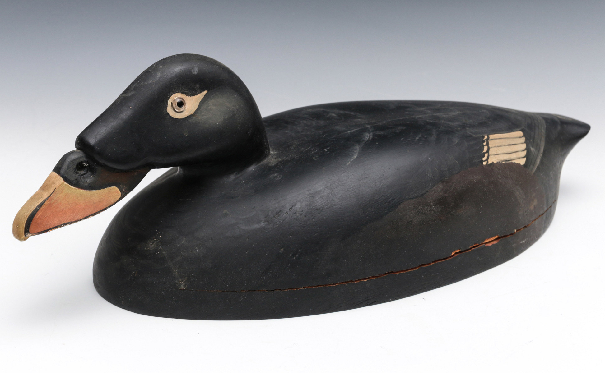 A SURF SCOTER PAINTED AD CARVED WOOD DECOY