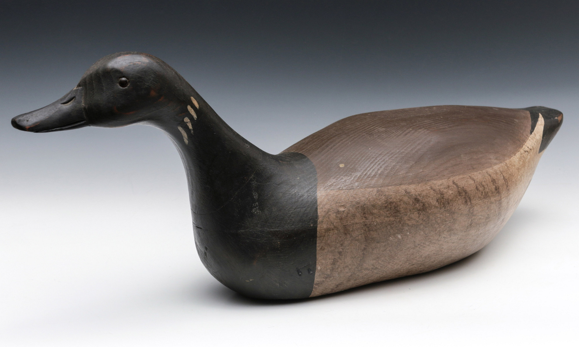 A CARVED AND PAINTED CANADA GOOSE FIGURE