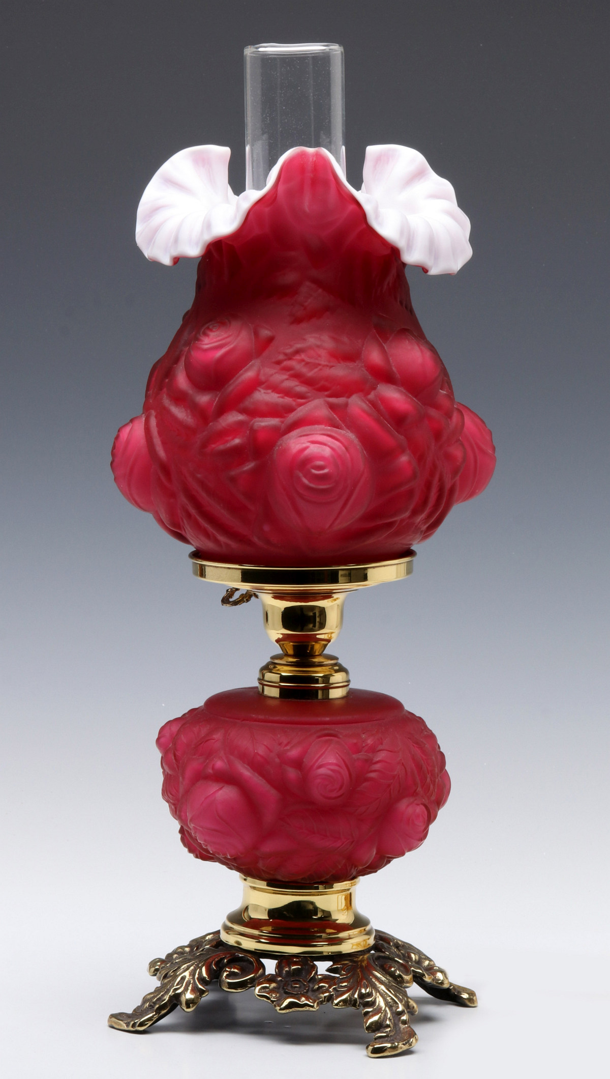 A FENTON CASED CRANBERRY BLOWN OUT SATIN LAMP