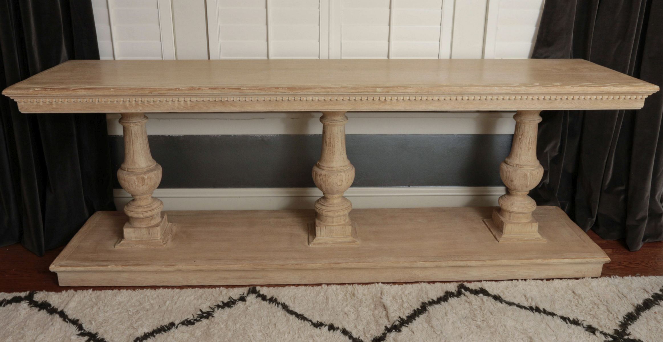A LARGE PICKLED OAK TWO TIER CONSOLE TABLE