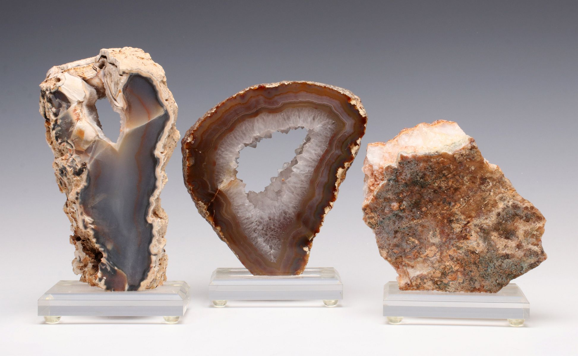 POLISHED GEODES AND MINERALS ON LUCITE DISPLAYS