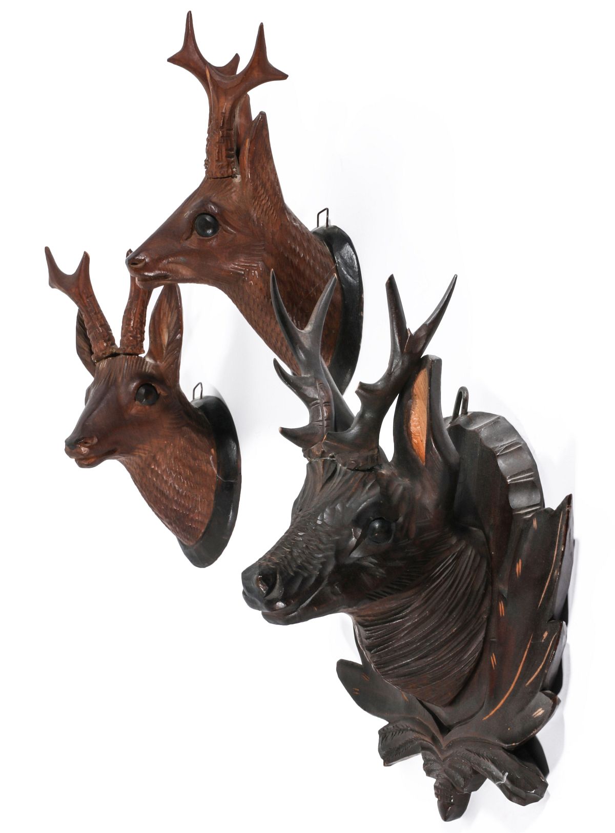 THREE SMALL BLACK FOREST DEER TROPHY CARVINGS