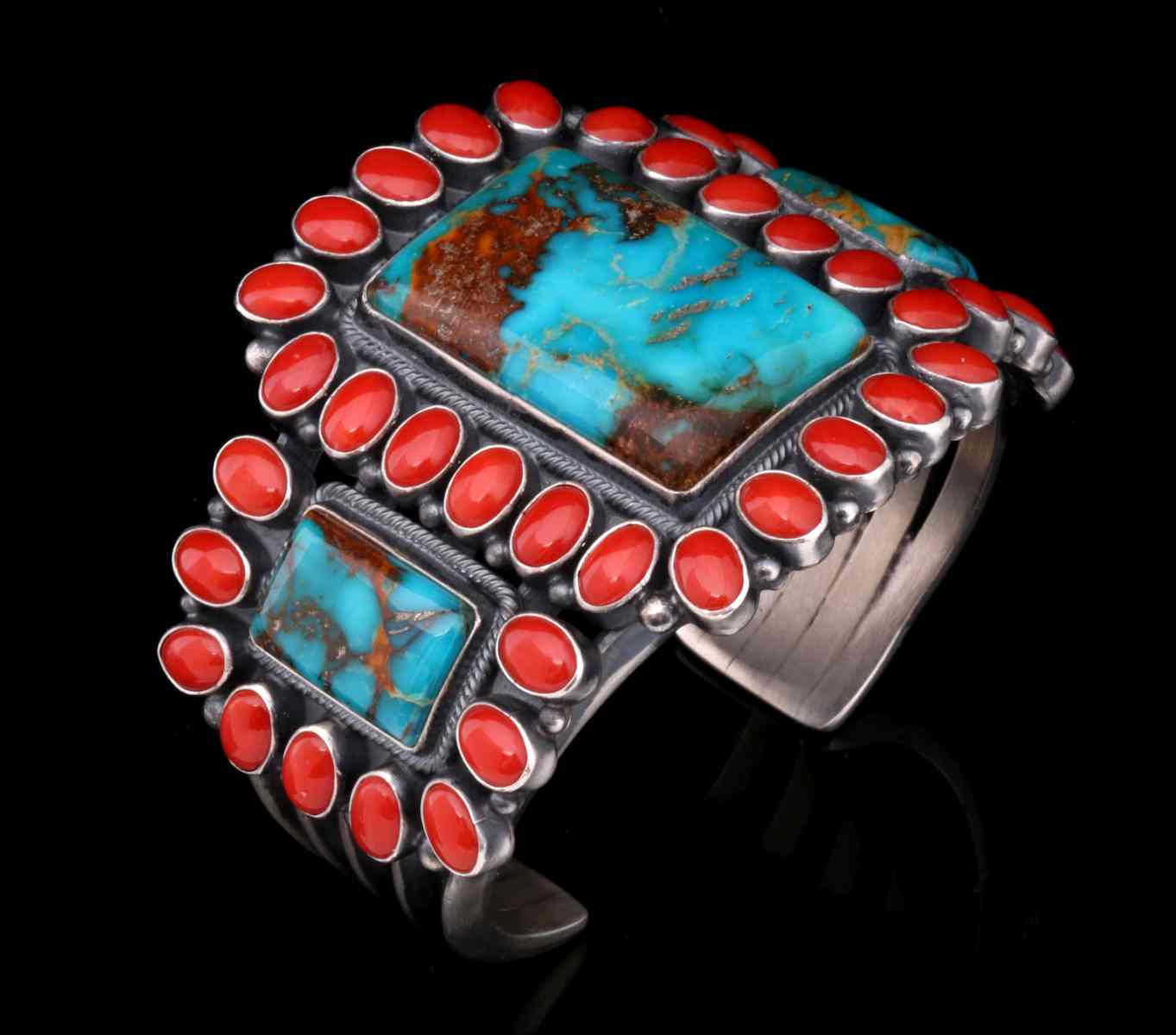 A COLORFUL KIRK SMITH CORAL AND TURQUOISE CUFF