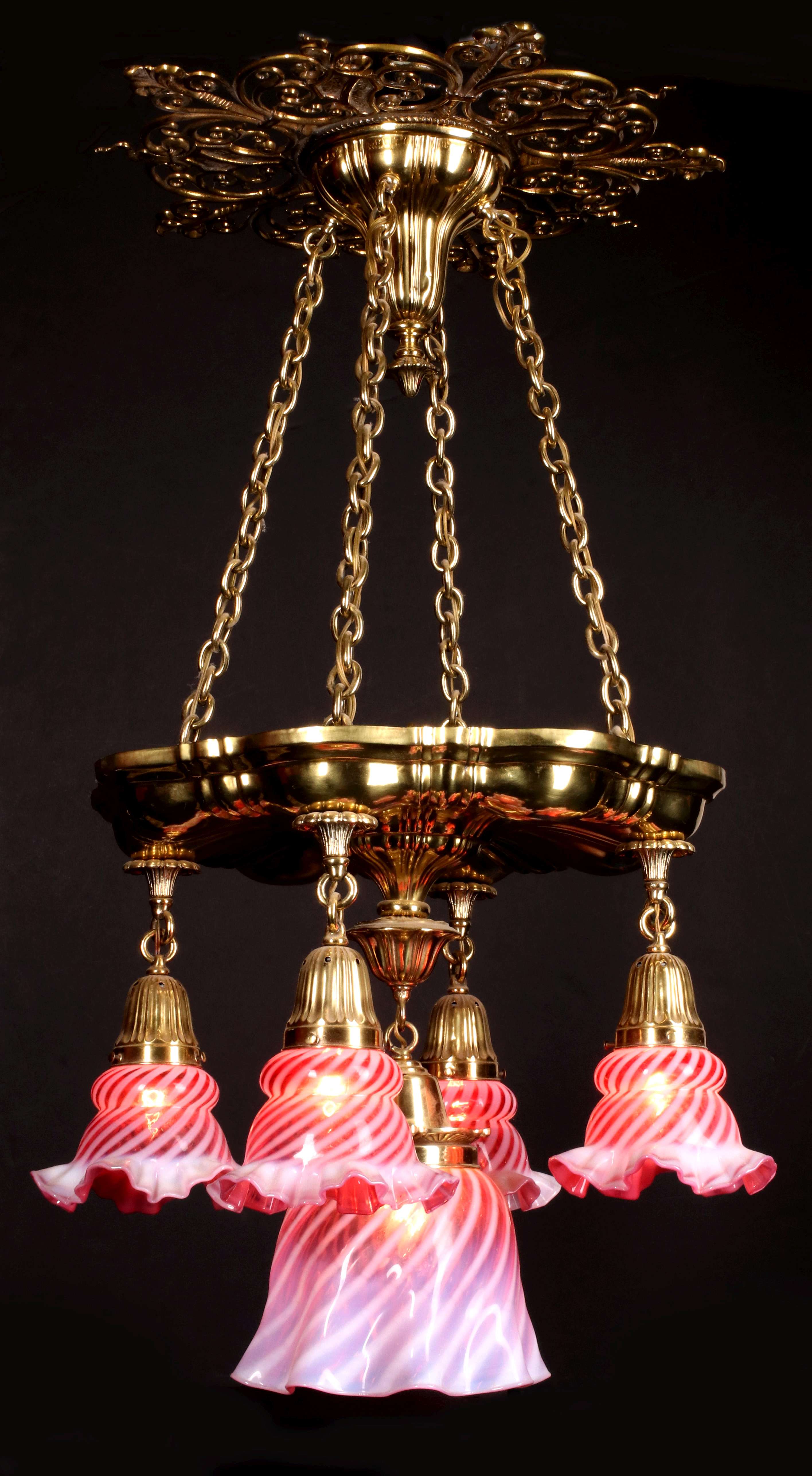 AN ANTIQUE CHANDELIER WITH FENTON GLASS SHADES