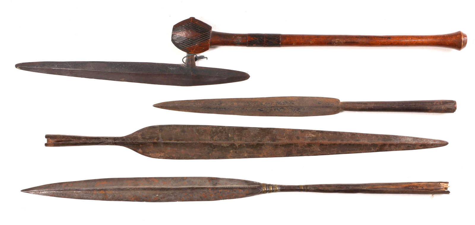 AN AFRICAN STABBING AXE AND THREE SPEAR HEADS