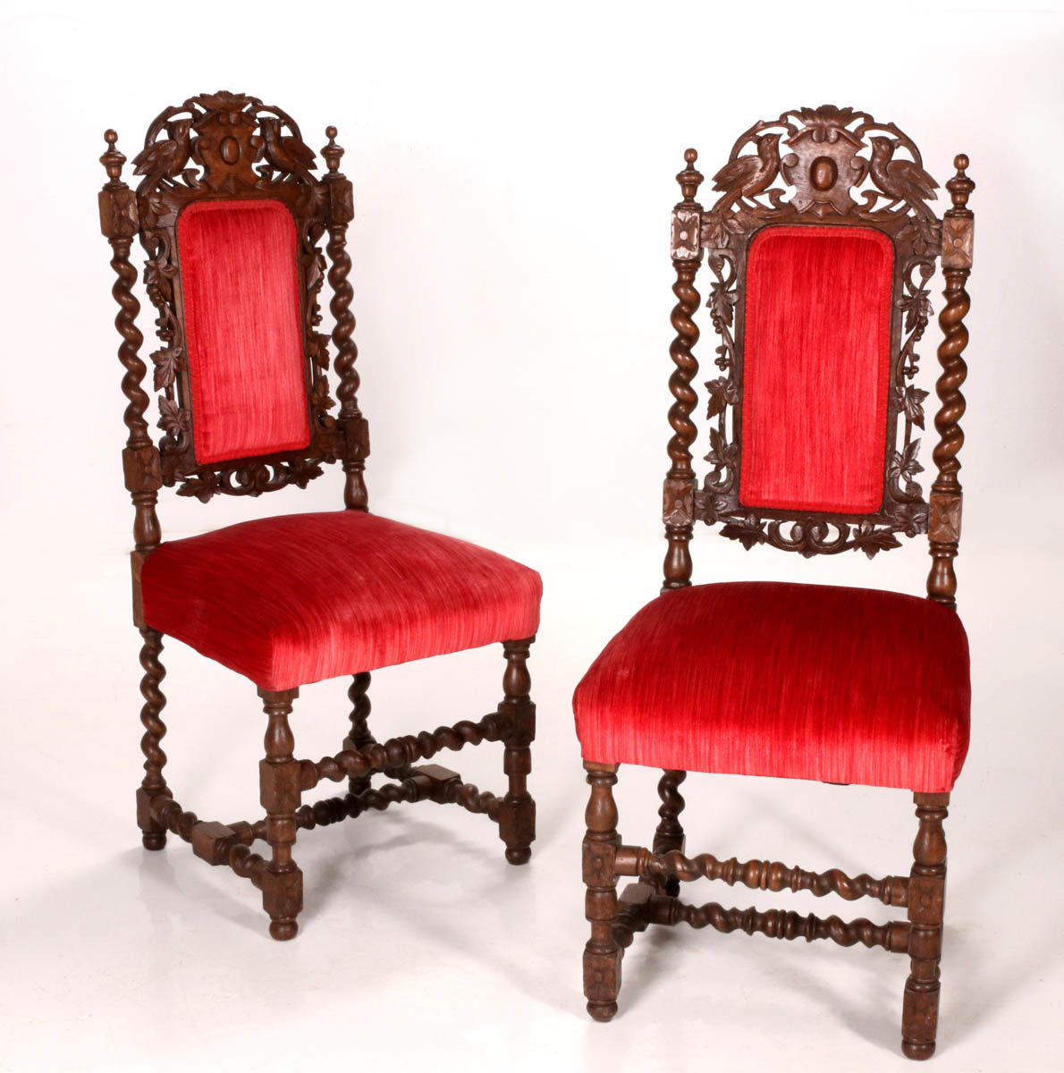 A PAIR HEAVILY CARVED OAK SIDE CHAIRS CIRCA 1900