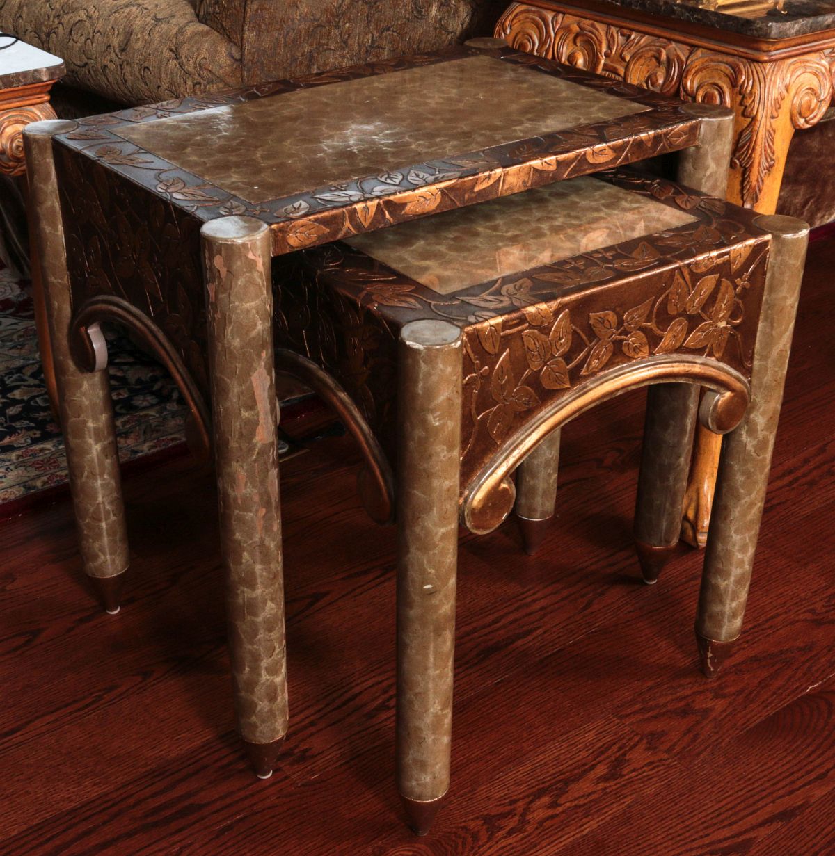 A PAIR OF DECORATIVE NESTING TABLES