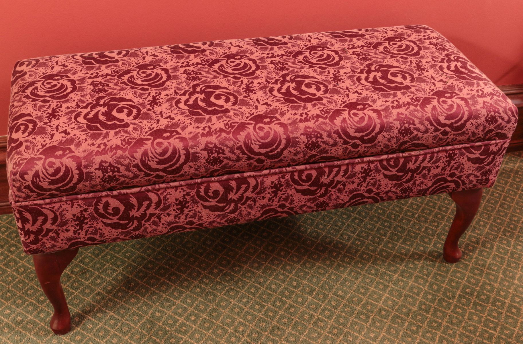 AN UPHOLSTERED BENCH