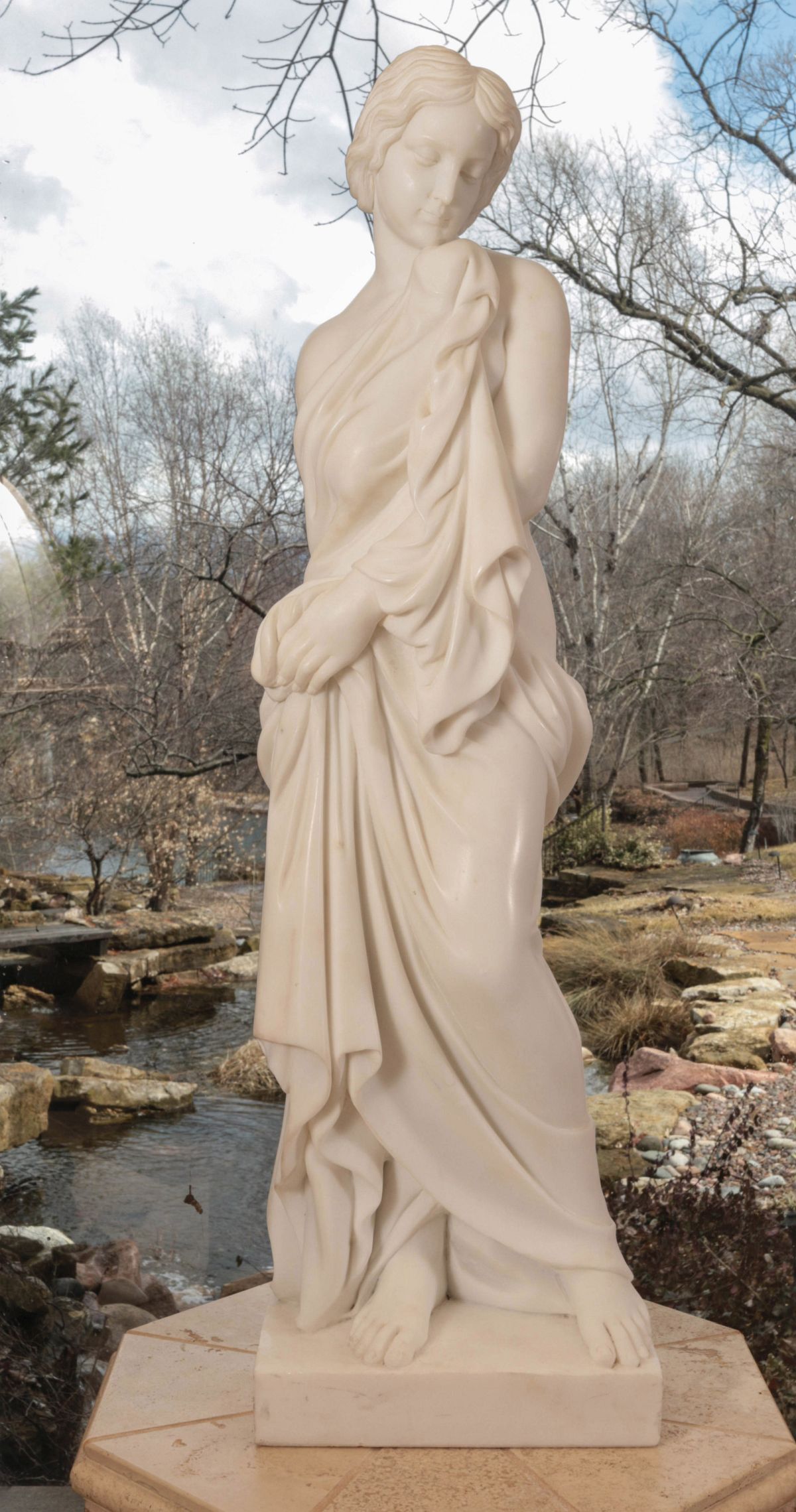 A LARGE CARVED MARBLE PORTRAIT OF CLASSICAL MAIDEN