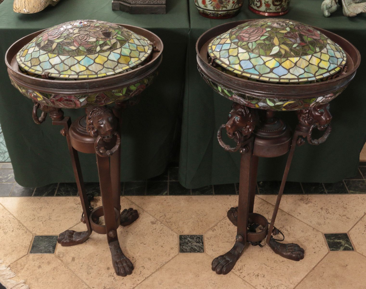 A PAIR OF BRONZE LIGHTED STANDS WITH LEADED GLASS