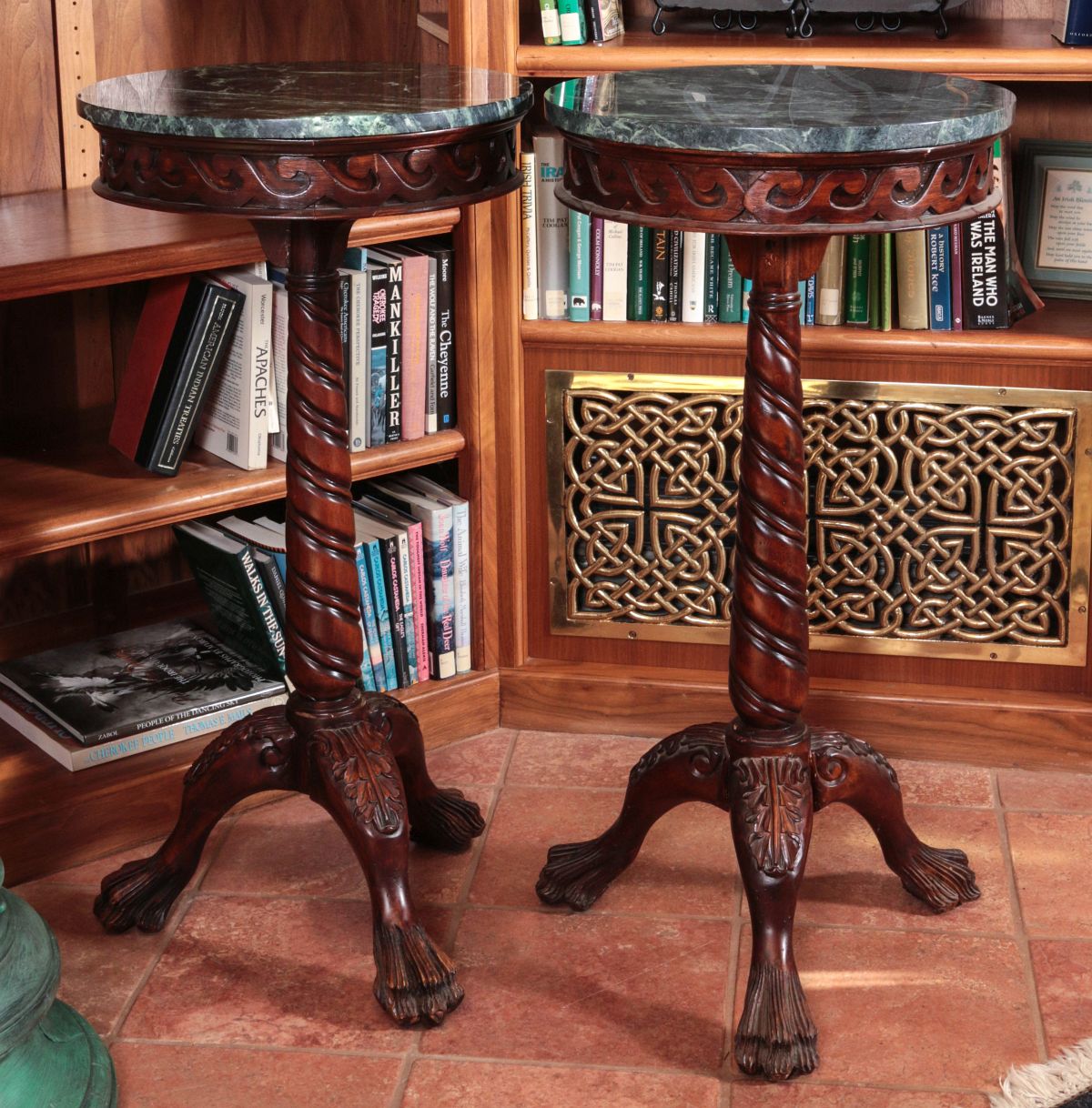 A PAIR OF CARVED MAHOGANY MARBLE TOP STANDS