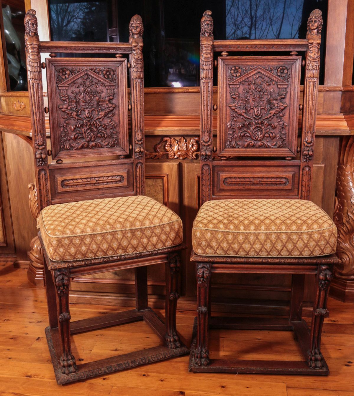 A PAIR HEAVILY CARVED JACOBEAN REVIVAL SIDE CHAIRS