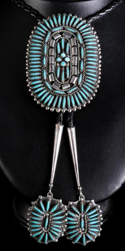 A ZUNI STERLING SILVER AND TURQUOISE BOLO TIE