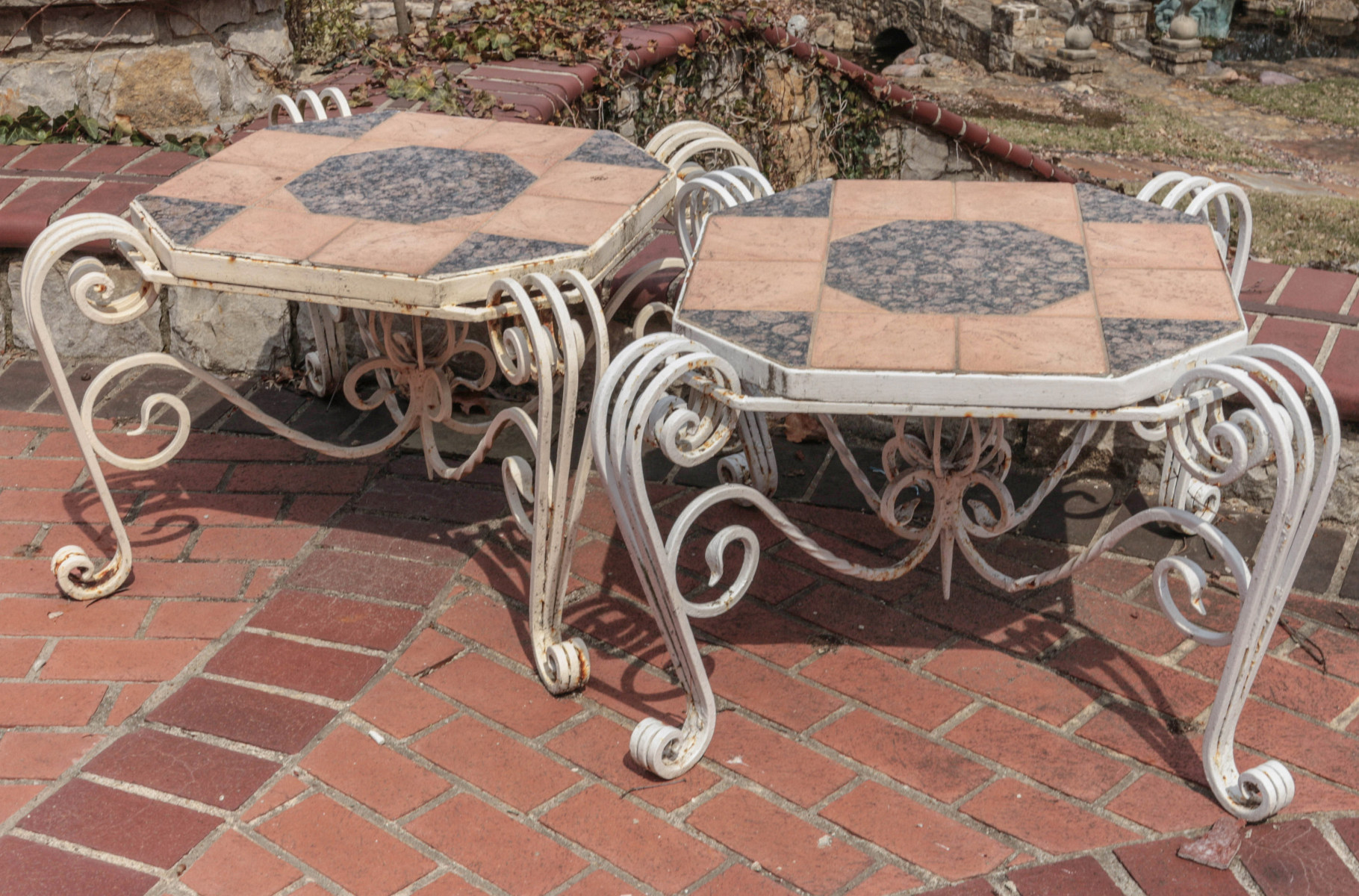 A PAIR IRON PATIO TABLES WITH GRANITE TILE TOPS