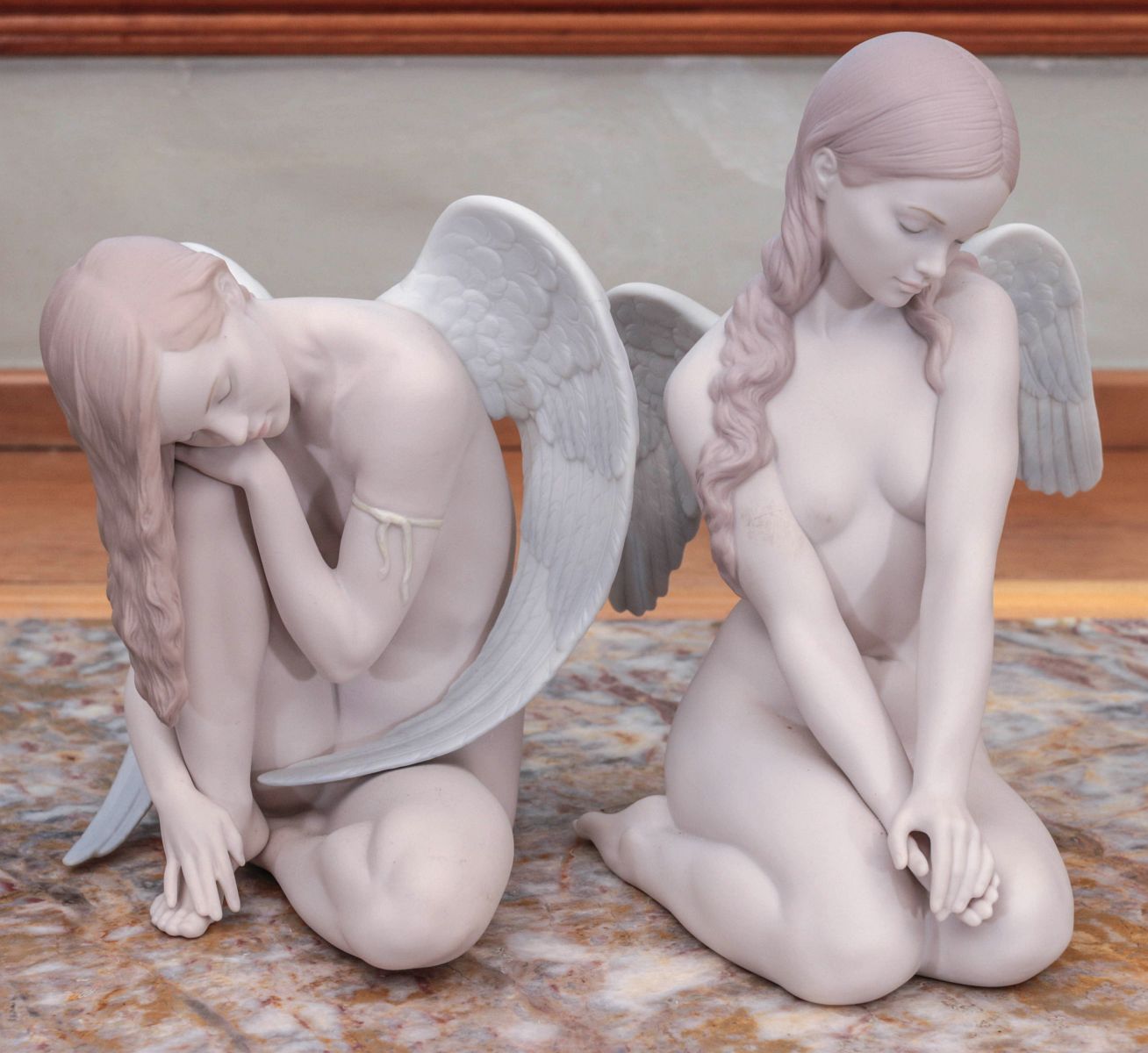 A PAIR OF LLADRO PORCELAIN ANGEL FIGURES