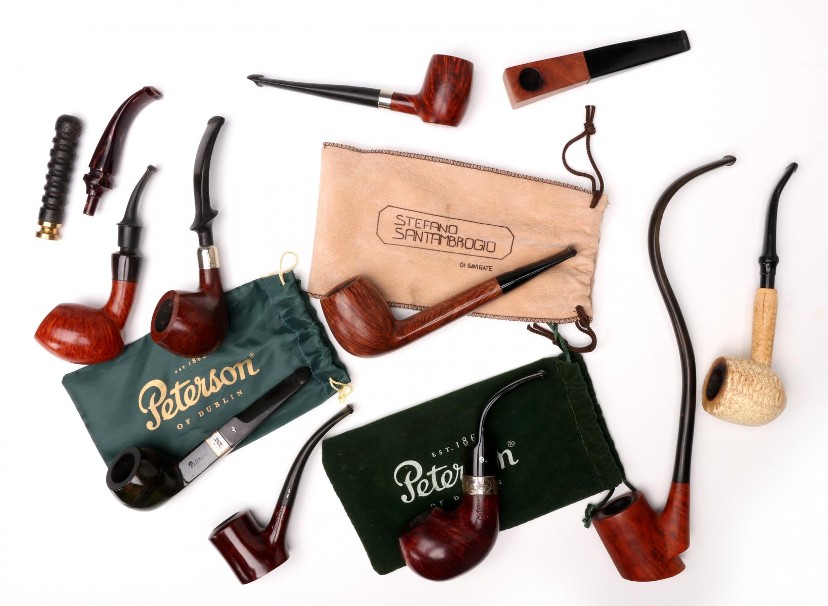 A COLLECTION OF PETERSON AND OTHER SMOKING PIPES