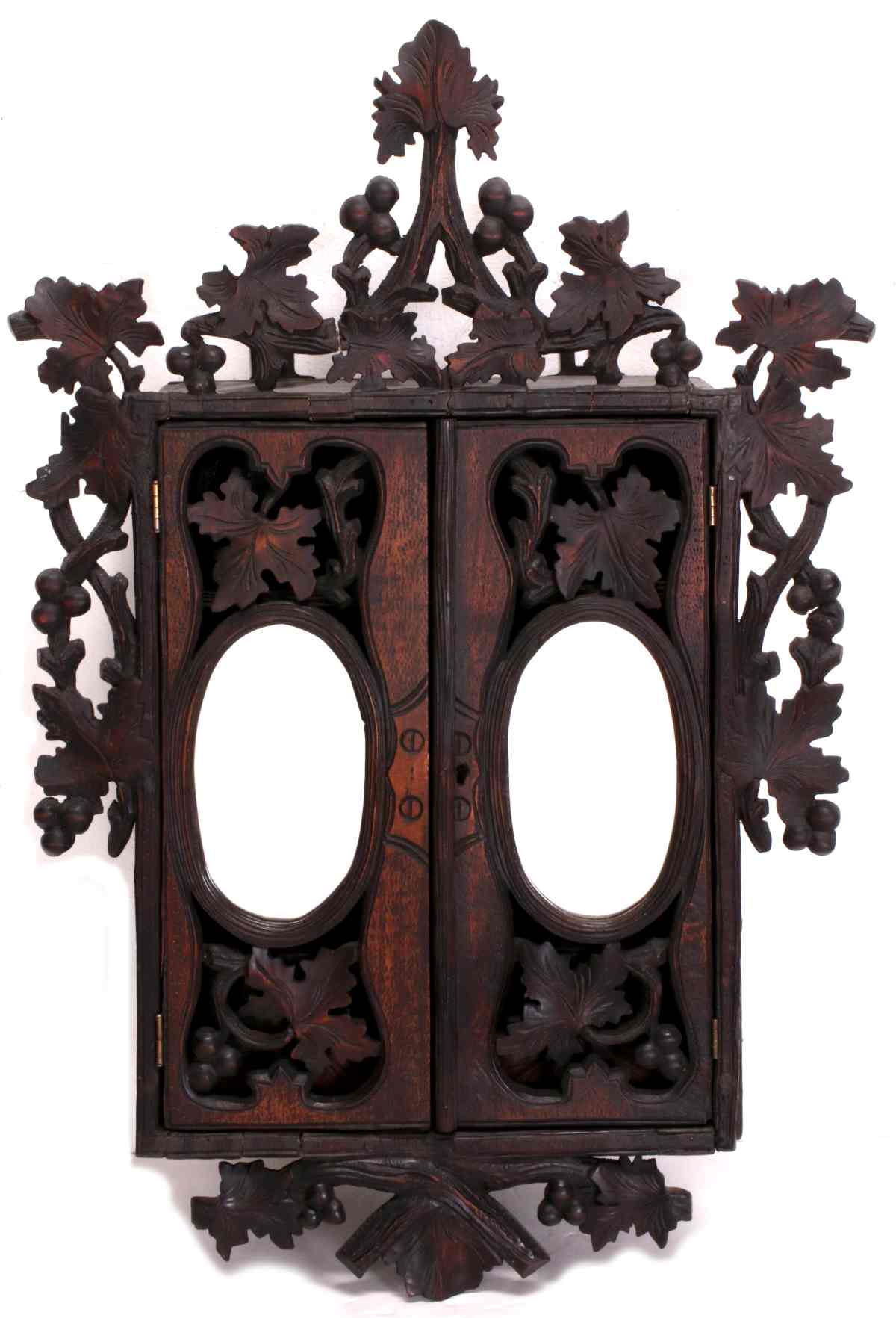 A CIRCA 1880 BLACK FOREST CARVED HANGING CABINET