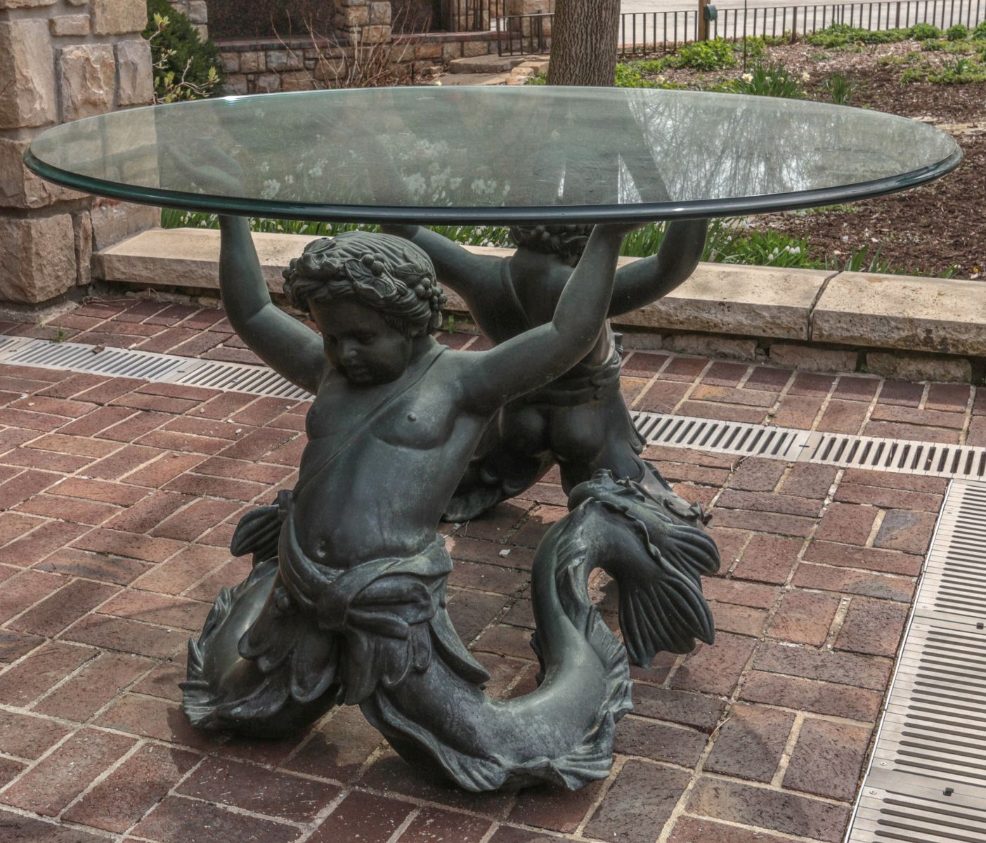 A LARGE CENTER TABLE WITH BRONZE MERMAN FIGURES