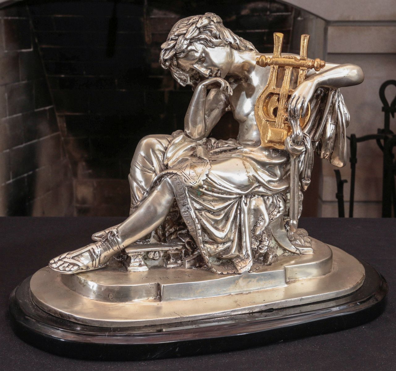 A CONTEMPORARY SILVERED BRONZE CLASSICAL MAIDEN