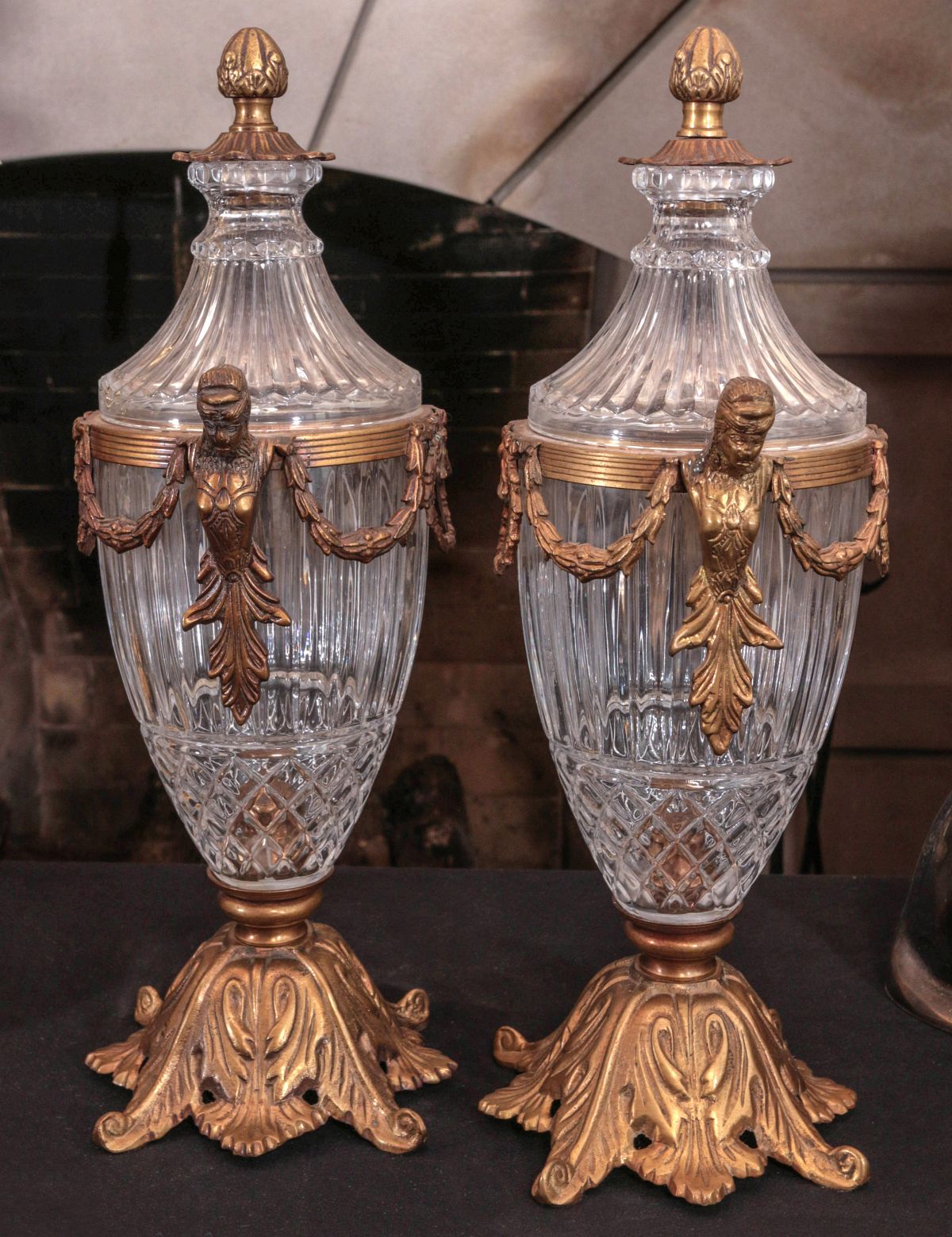 A PAIR CONTEMPORARY BRONZE MOUNTED CRYSTAL URNS